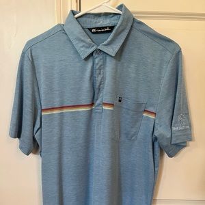 Travis Mathew golf shirt in Medium.  Light blue with cool pattern across front.